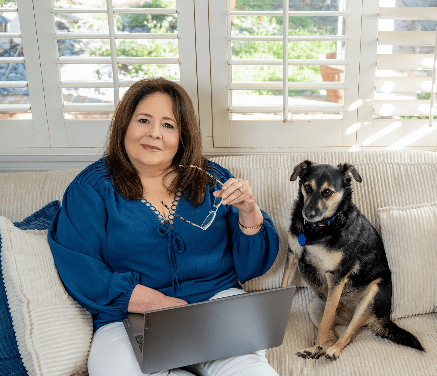 Nikki Safavi at home with her dog