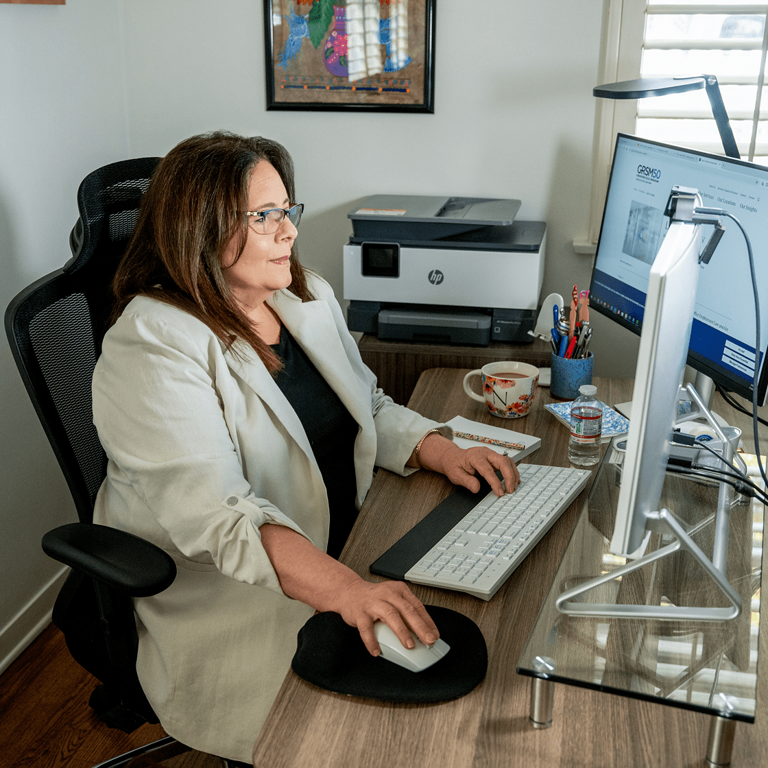 Nikki Safavi working at her desk